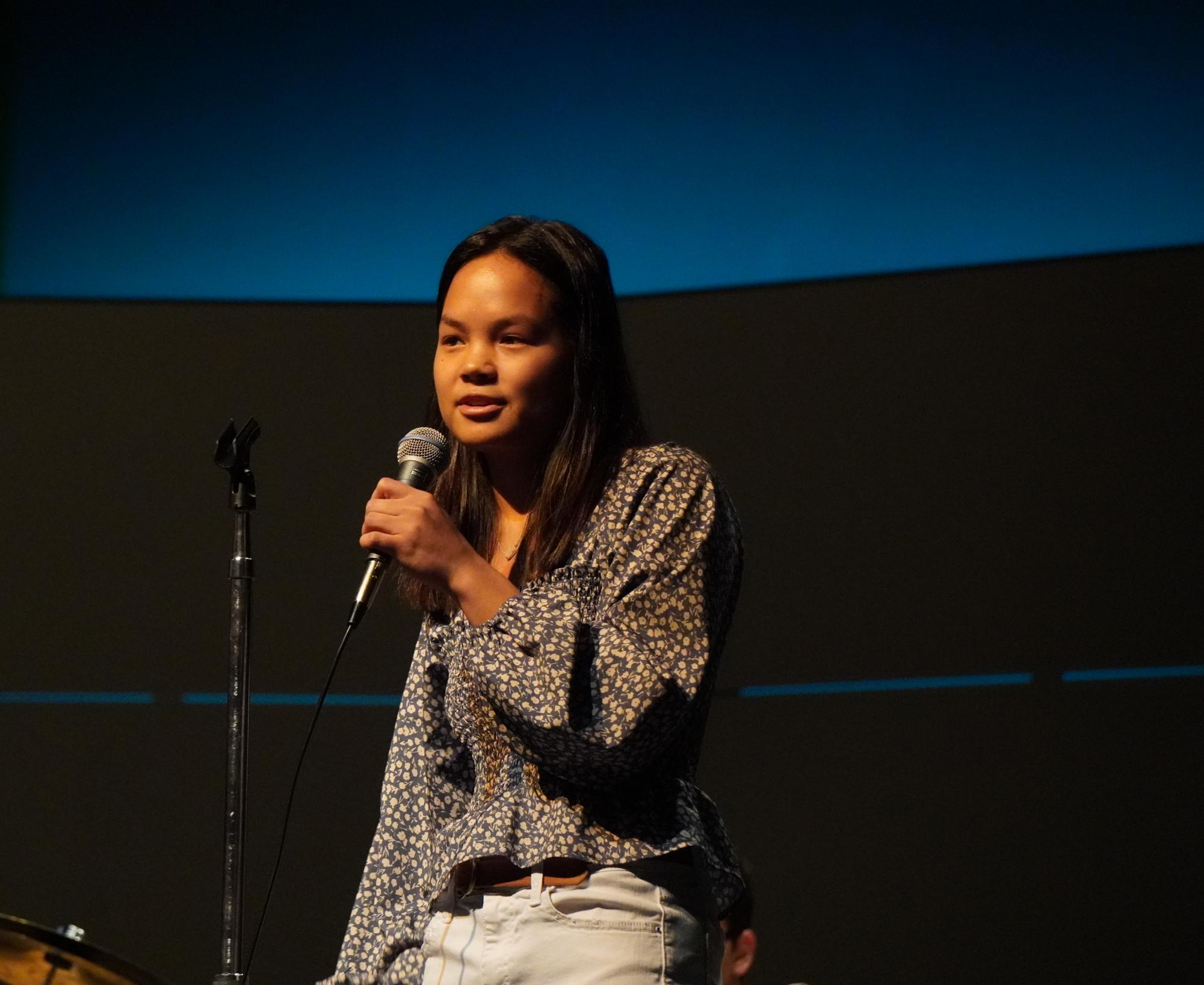 Ele Winner speaks to the audience at the 2024 Woodgrove Idol competition. Photo provided by Woodgrove Journalism.