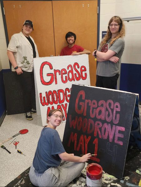 Woodgrove students working on “Grease” signs from left to right: Colin McIntyre, Nathan Nocon, Sean Harris, and Dani Vitello. Photo provided by Woodgrove Theater. 