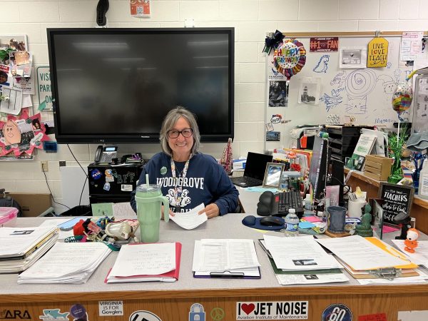 Ms. Gina Bingaman sitting at her desk in her classroom L604.  Photo provided by Mrs. Chelsea Dyke. 
