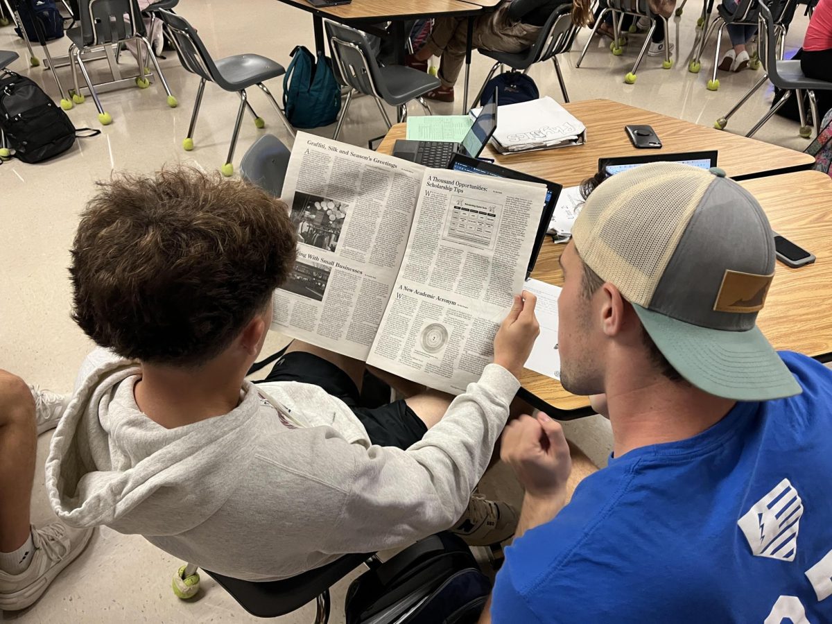 Woodgrove students read a newspaper in their spare time. Photo provided by Brooks Frandsen.