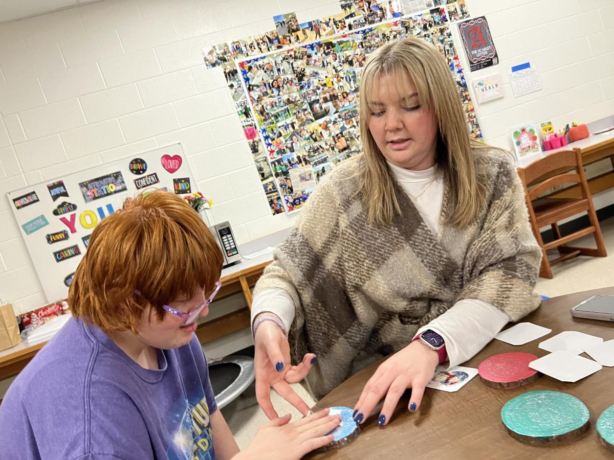 Transition student working on different crafts to sell at the Holiday Market. Photo provided by Kelsey Seymour.
