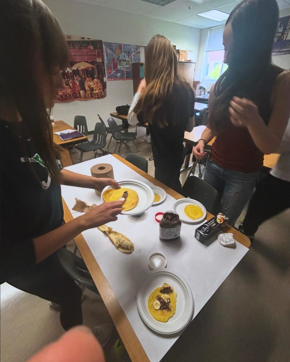 Students interact at a French Club meeting. Photo Provided by Anjy Ary.
