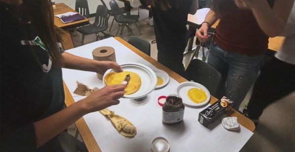 Students interact at a French Club meeting. Photo Provided by Anjy Ary.
