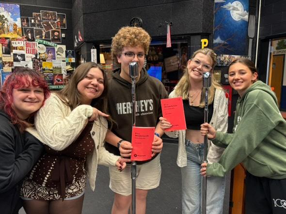 It’s a Wonderful Life cast practices delivering lines into a microphone. Photos provided by Beverly Pruzina.
