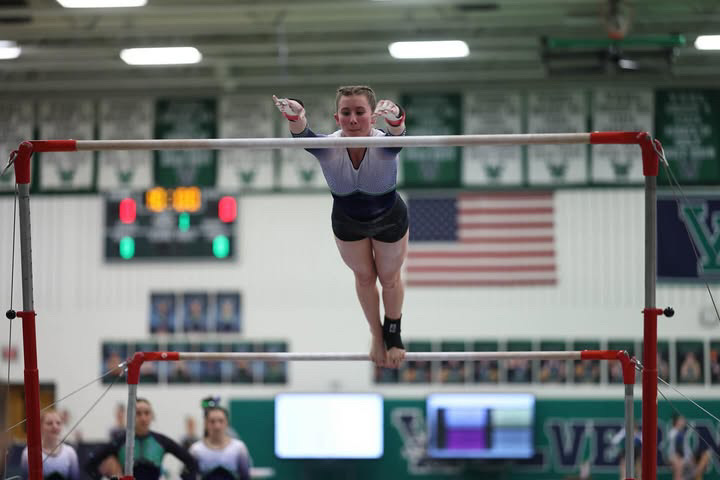 Jadyn Thomas on the uneven bars. Photo provided by Plaid Sheep Creative. 
