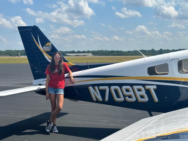 Nickola standing next to an airplane from flight training. Photo provided by Brinnay Nickola.
