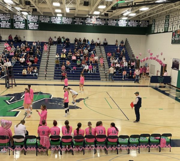 Woodgrove Varsity Volleyball plays their rival school Loudoun Valley at the Dig Pink volleyball game. Photo provided by Ashley Hohm.