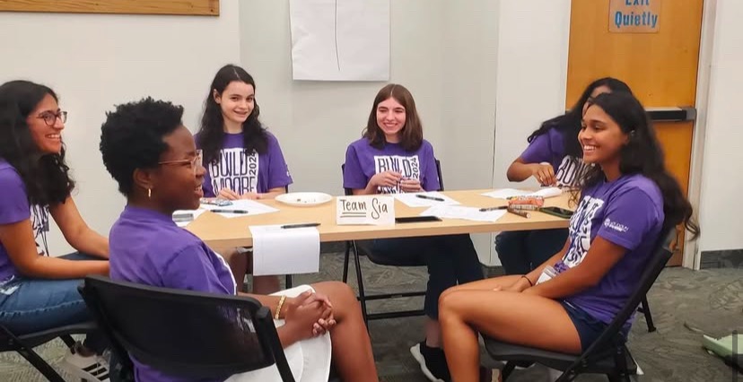 Woodgrove Key Club founder Iza Piatkowski sits with members of the Claude Moore Community Builders during leadership and communication training. Photo provided by Iza Piatkowski.
