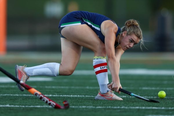 Junior Natalie Harrison sweeps the ball while trying to score. Photo provided by Steve Prakope.