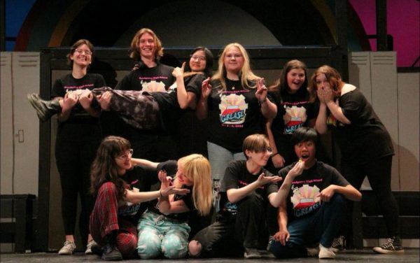 The Technical Leadership prepares to take a photo while wearing their shirts for Grease the musical. Photo provided by Kennedy Dehler.
