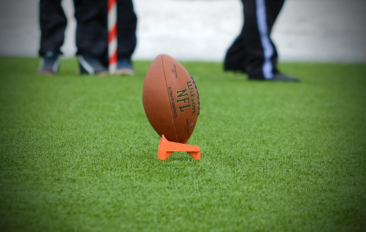 An NFL football on a holder. Photo provided by Storyblocks. 