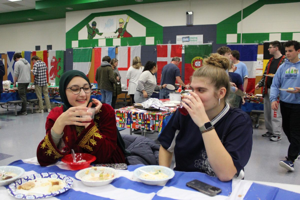 Salma Jawad (left) and Breanna Young enjoy International Food Night. Photo provided by Woodgrove Journalism. 