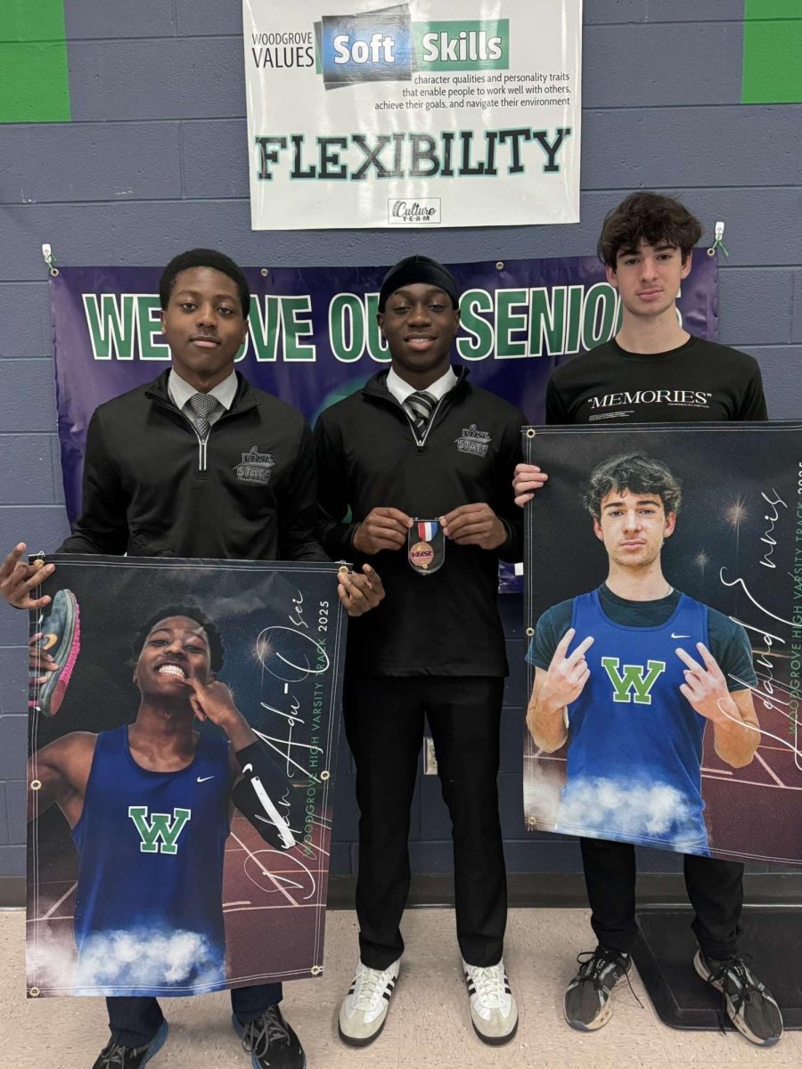 Seniors Dylan Adu-Osei and Leland Ennis along with junior Owen Ngonga after their team banquet. 
