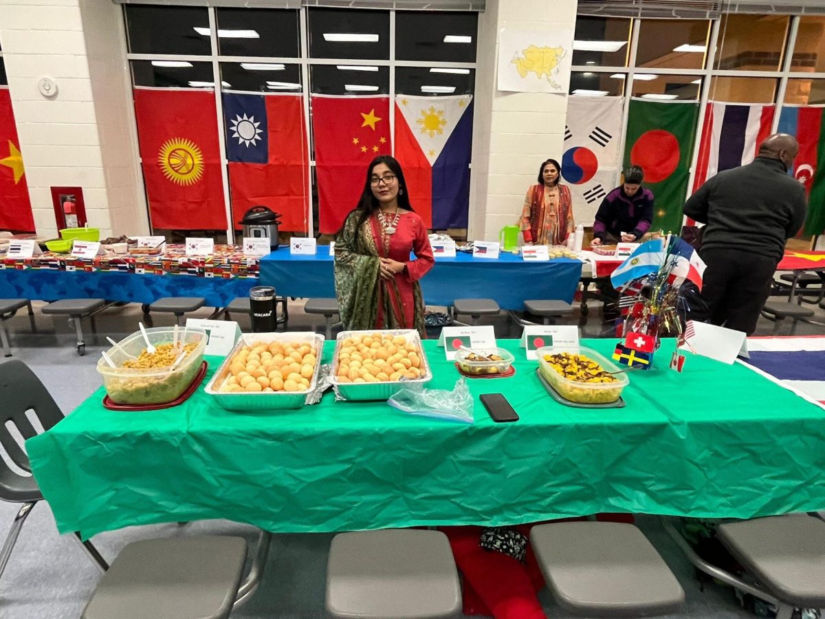 Totini presenting her country’s foods at International Food Night. Photo provided by Mahitha Ahsan Totini.
